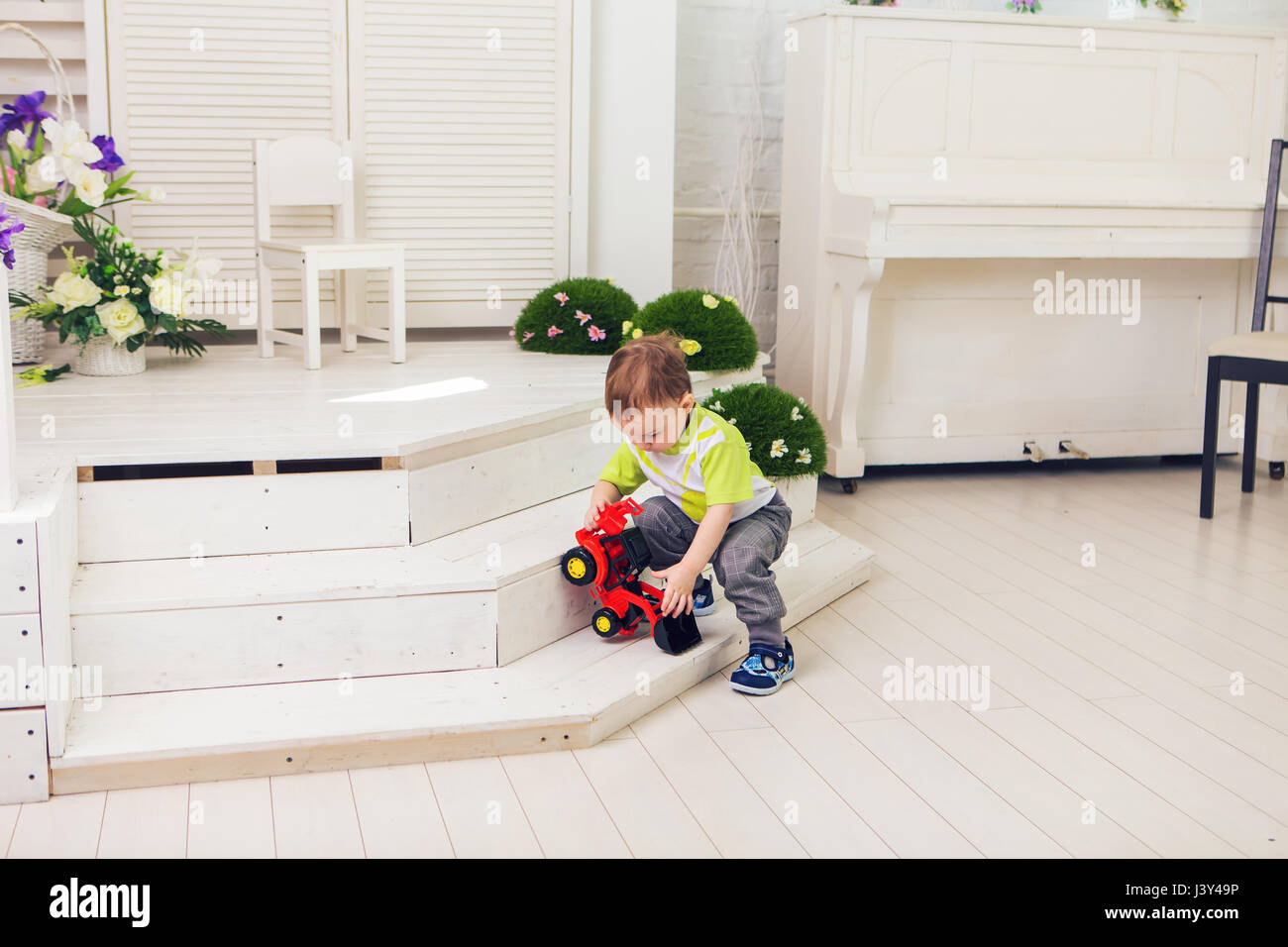 Little boy is playing with toy car at home Stock Photo - Alamy