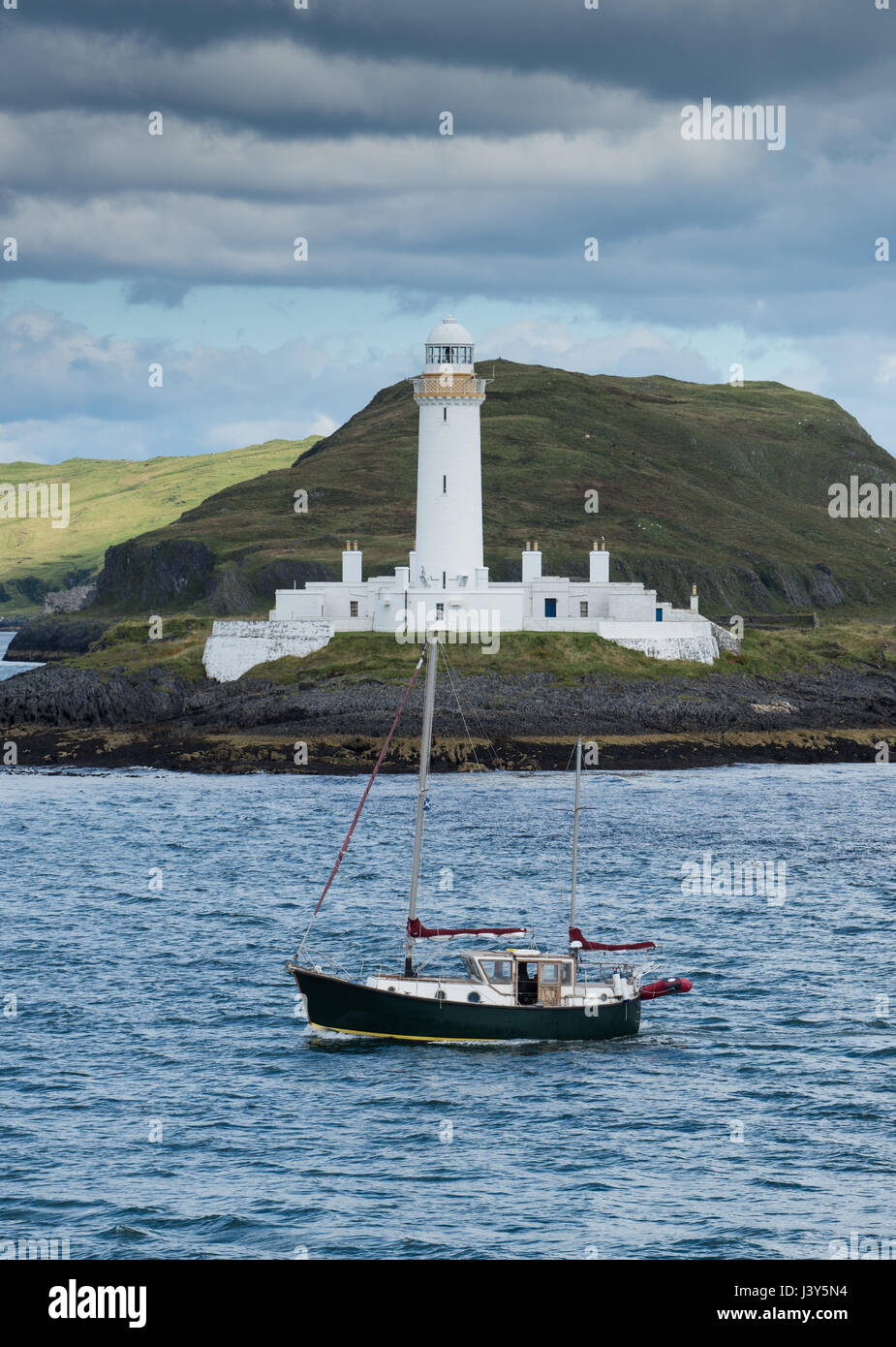 Lismore Lighthouse and fishing boat, Lady's Rock, Lismore, Argyll and Bute, Scotland.UKJ Stock Photo