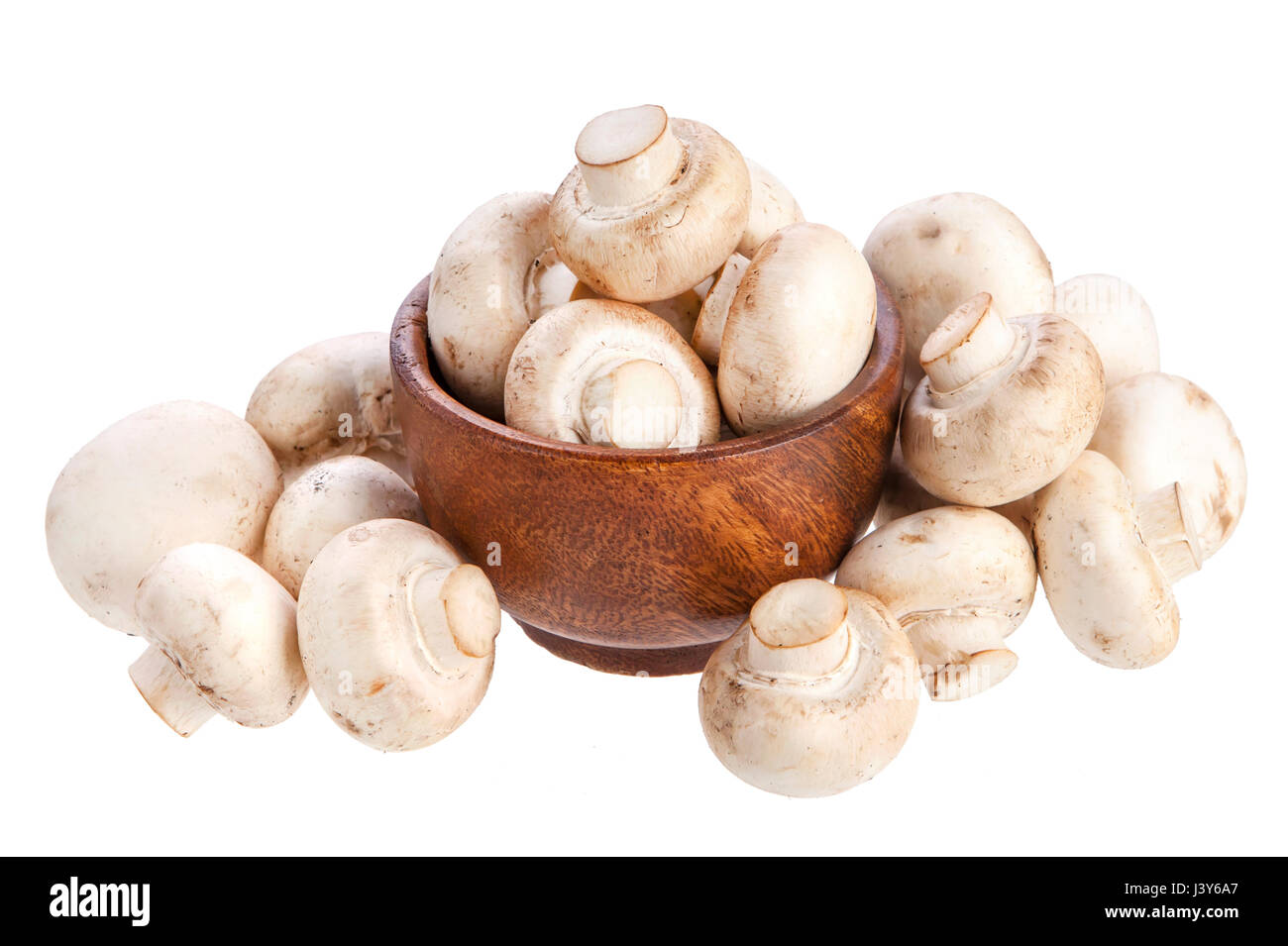 Mushroom champignon in wooden bowl isolated on white background Stock Photo