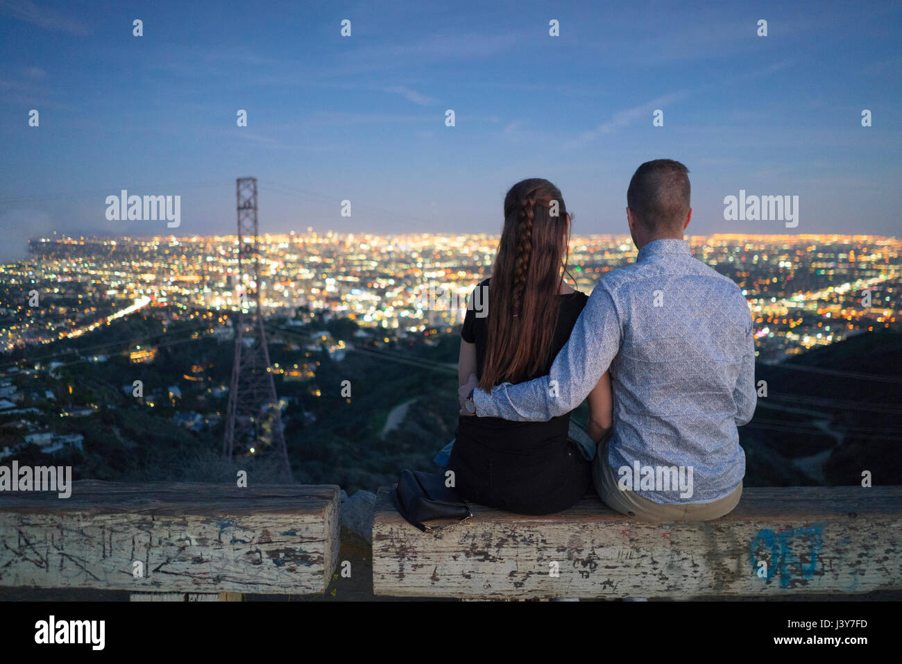 Rear view of couple looking away at view, Runyon Canyon, Los Angeles, California, USA Stock Photo