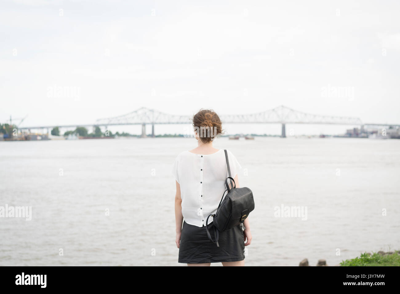 Rear view of woman looking at New orleans bridge, Mississippi river, French Quarter, New Orleans, Louisiana, USA Stock Photo