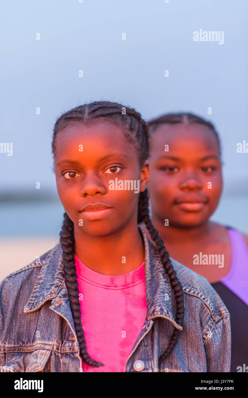 Portrait of two girls outdoors, at sunset Stock Photo