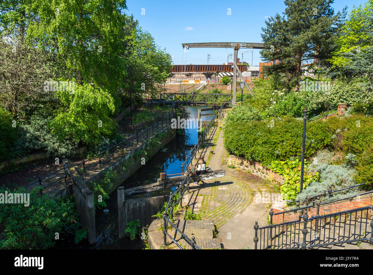 A lock on the Manchester and Salford Junction Canal where it joins the River Irwell, Manchester, England, UK Stock Photo