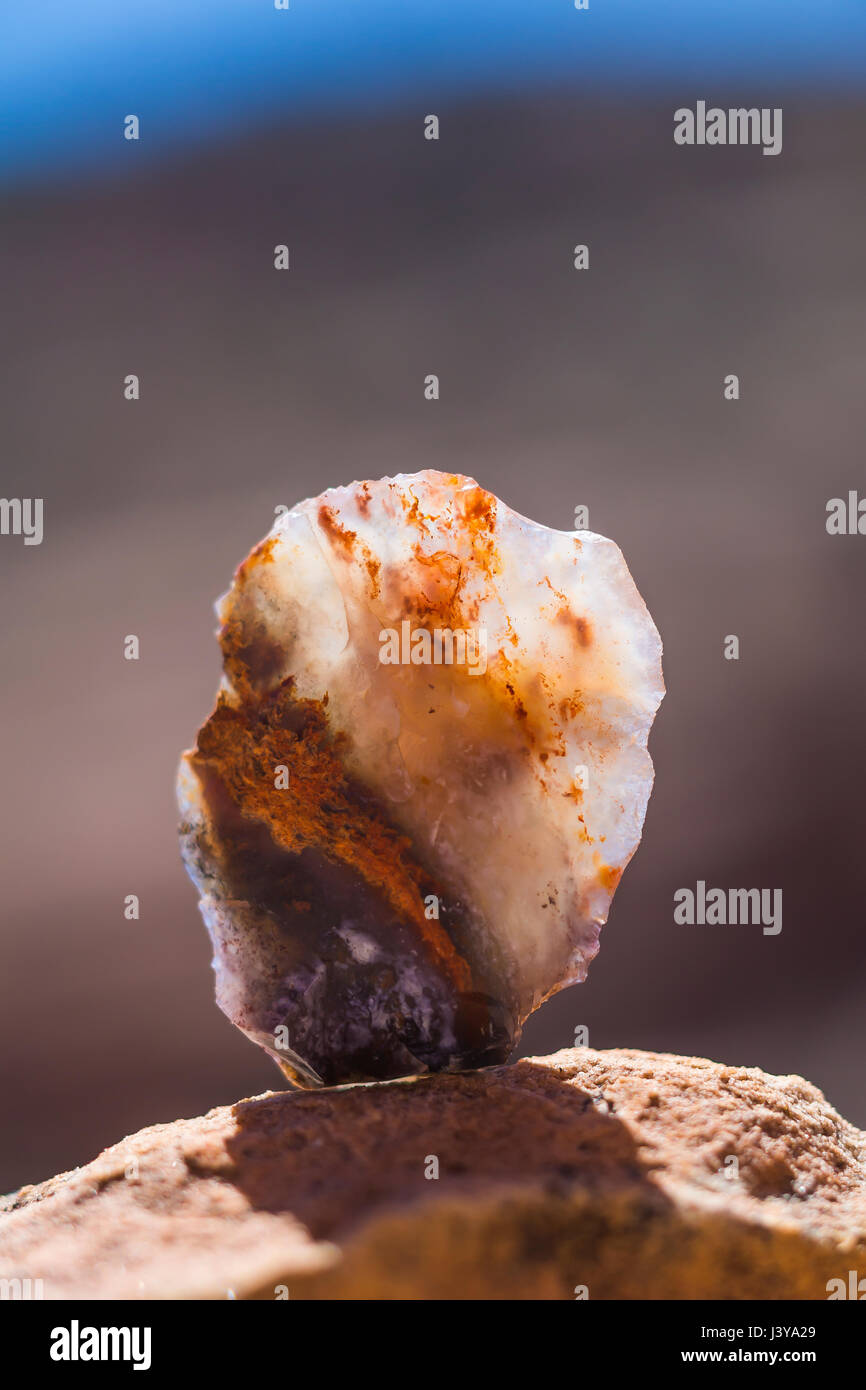 Worked chalcedony tool (photographed where observed, then left at the site) near an Ancestral Puebloan ruin in Road Canyon in Bears Ears National Monu Stock Photo