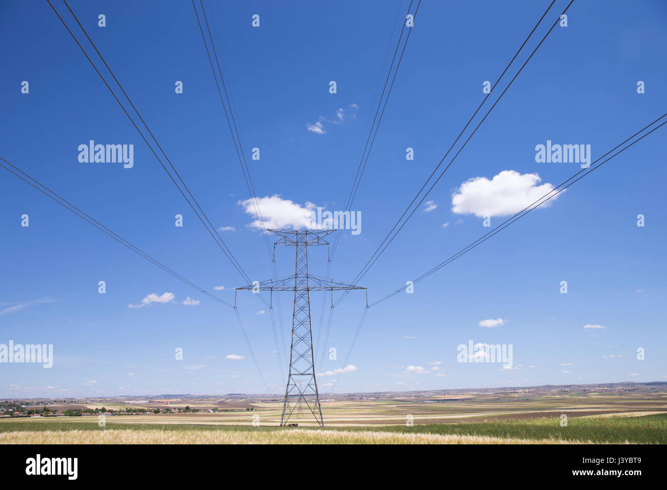 High voltage tower with a blue sky Stock Photo - Alamy