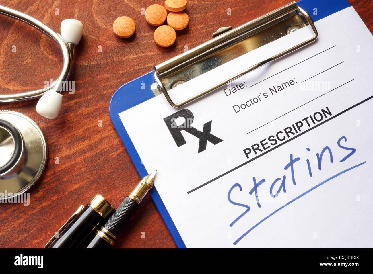 Clipboard with written prescription statins and stethoscope. Stock Photo