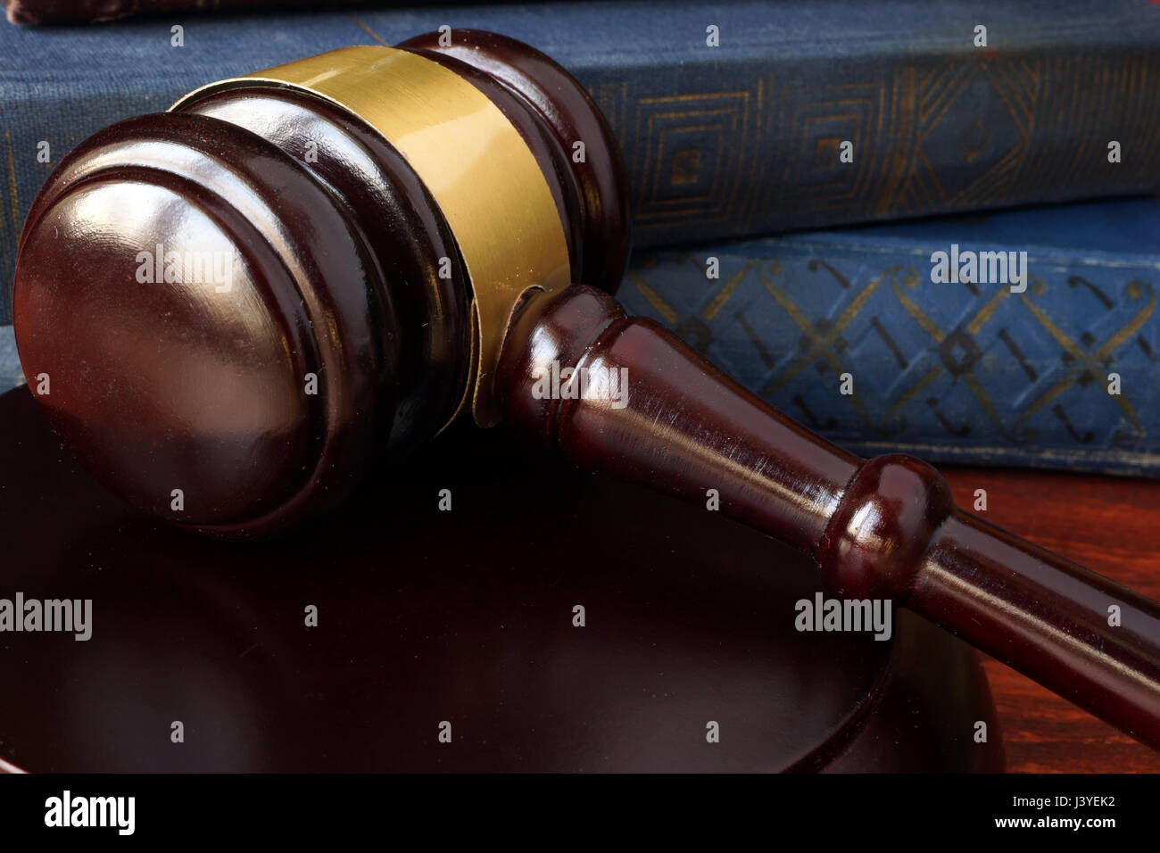 Justice concept. Gavel and book with law on a table. Stock Photo