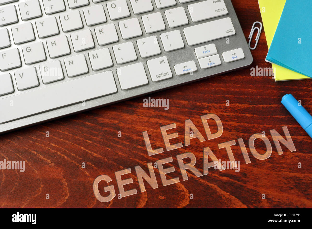 Lead generation written on a wooden surface. Stock Photo