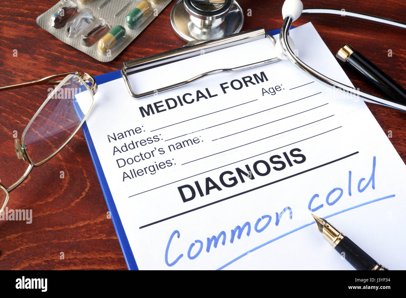 Medical form with diagnosis Common cold in a hospital. Stock Photo