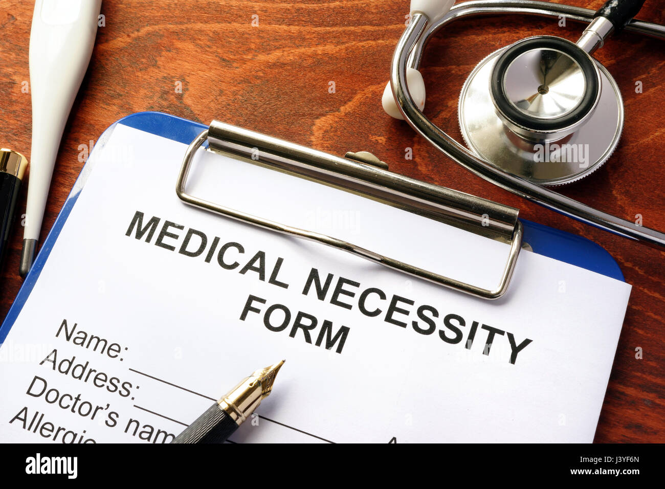 Medical Necessity form on a table. Stock Photo