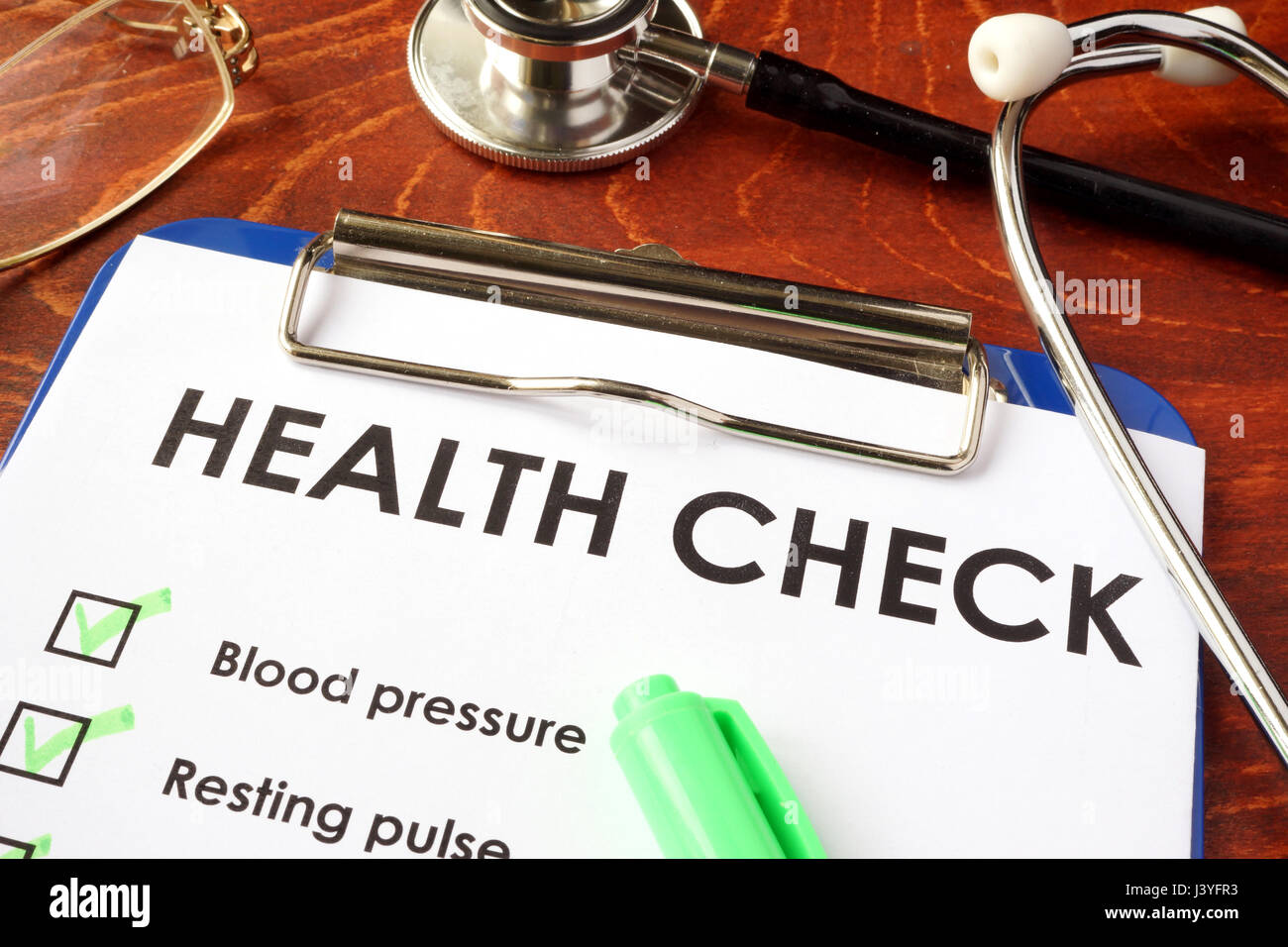 Health check form on a clipboard. Medical exam concept. Stock Photo
