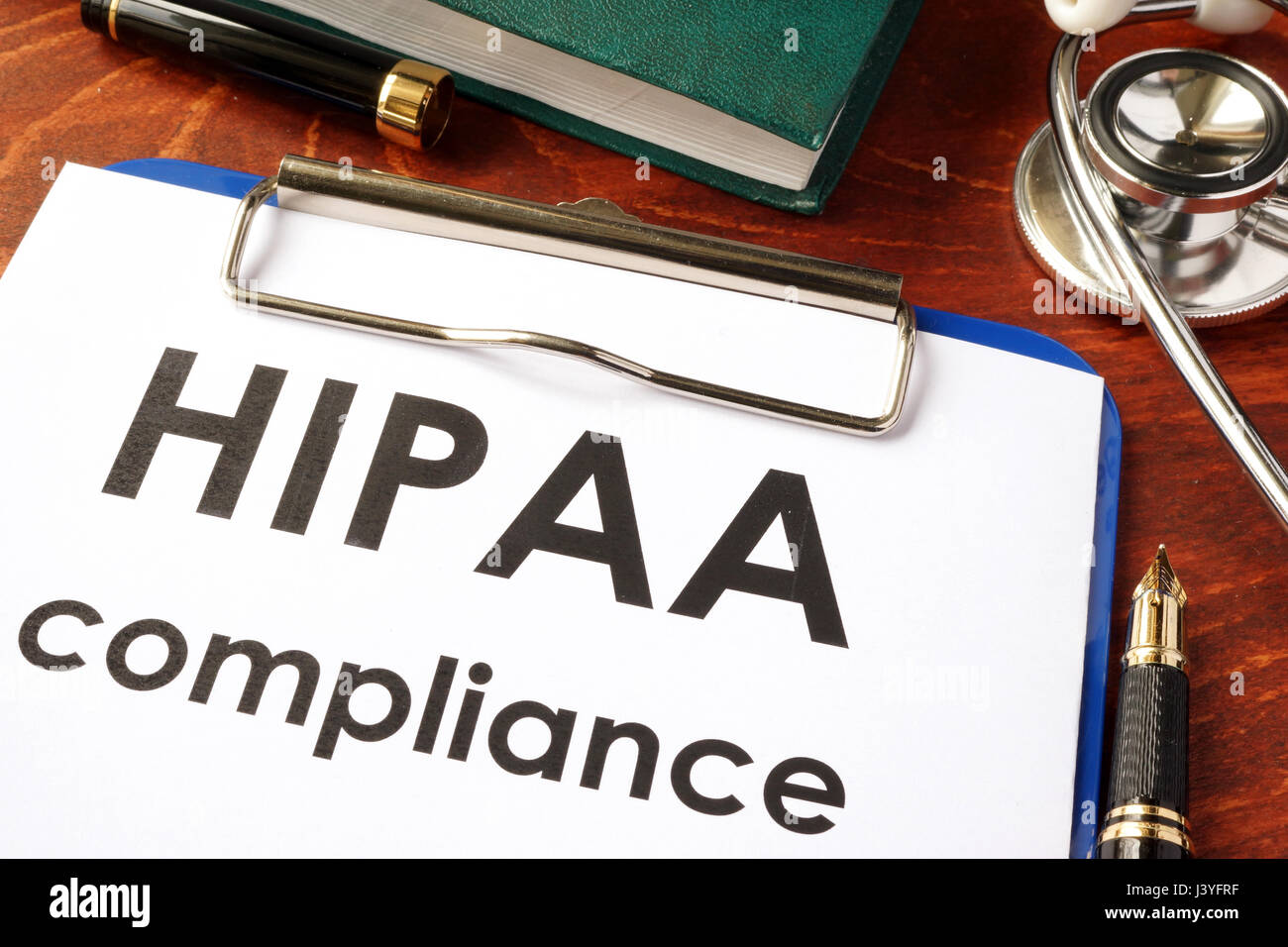 HIPAA compliance form on a clipboard. Medical privacy concept. Stock Photo