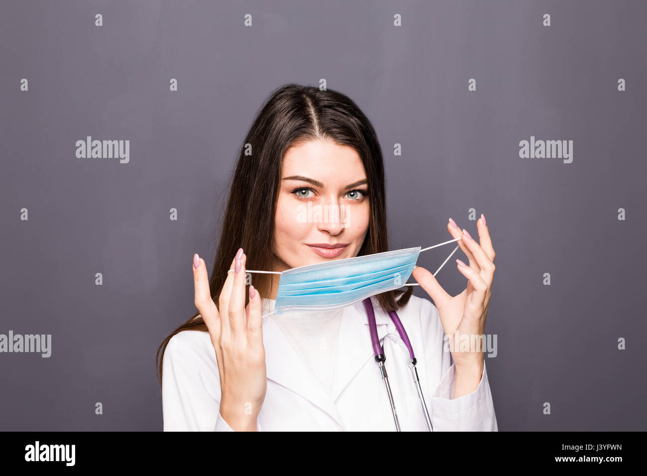 Portrait of Beautiful smiling female Surgeon wearing Mask Stock Photo ...