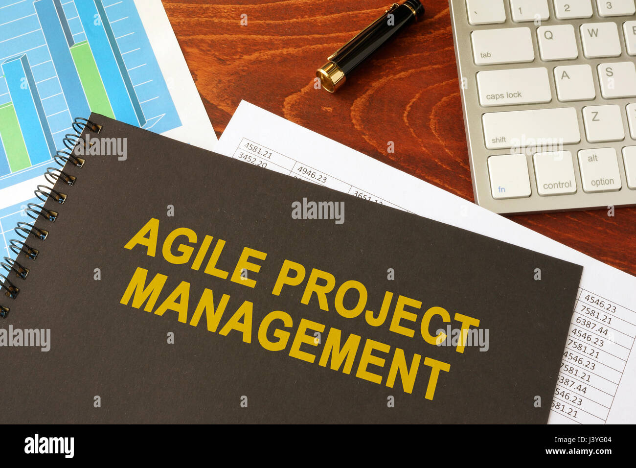 Book with title agile project management in an office. Stock Photo