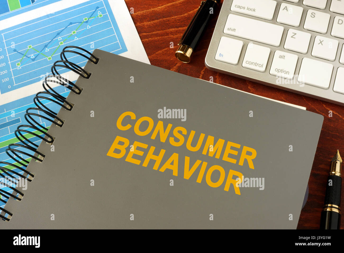 Book with title consumer behavior in an office. Stock Photo