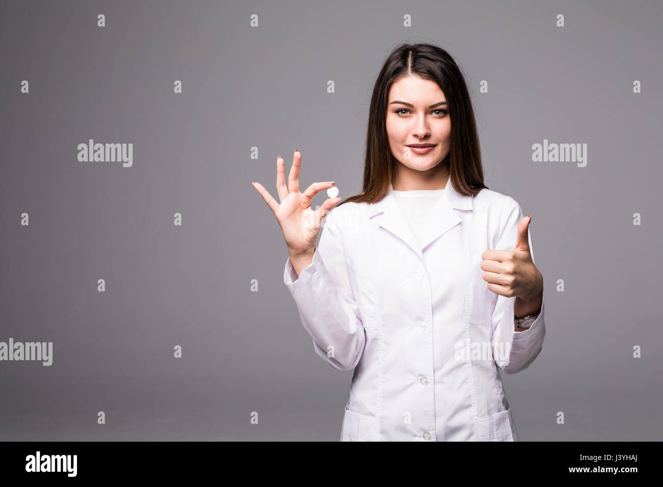 Female doctor giving a thumbs up hi-res stock photography and images ...