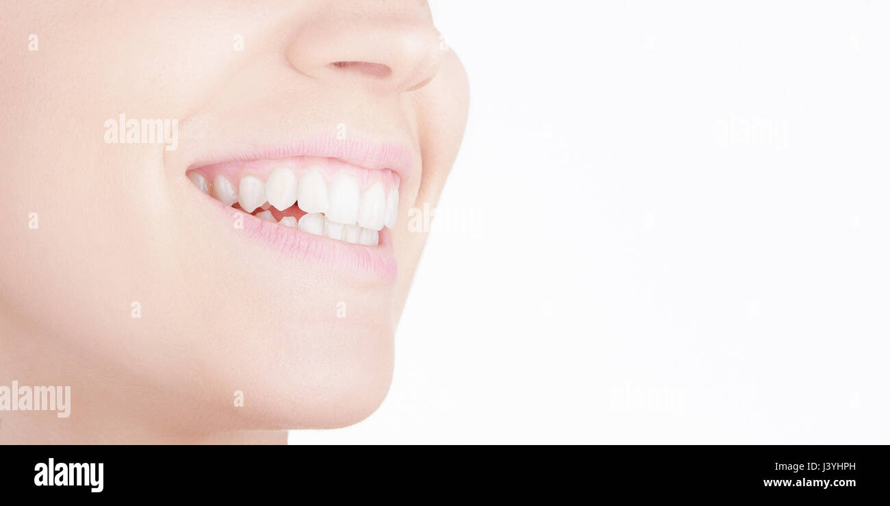 Smile with white teeth and pink lips Stock Photo