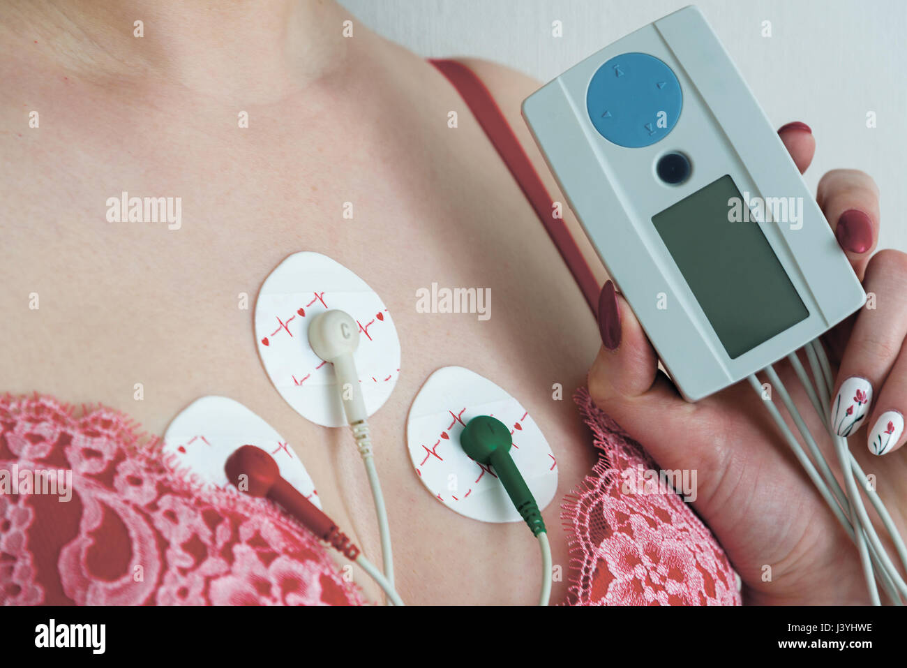 Electrodes Holter monitoring on the chest of a woman Stock Photo Alamy