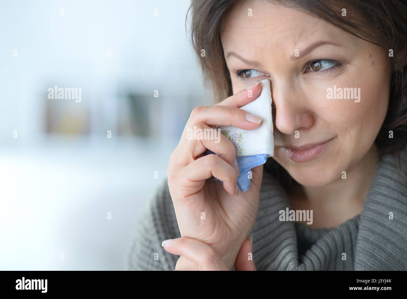 Crying young woman close-up Stock Photo