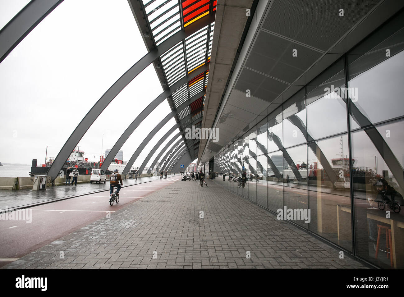 Taking a walk at Amsterdam Centraal Station Stock Photo