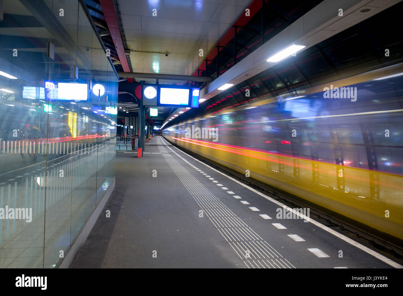long exposure capture of train station in Amsterdam. Stock Photo
