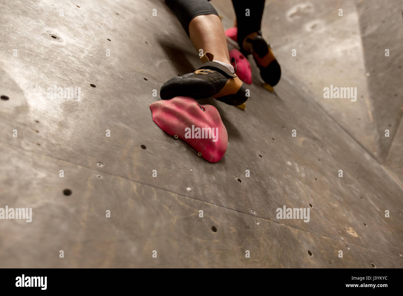 foot of woman exercising at indoor climbing gym Stock Photo