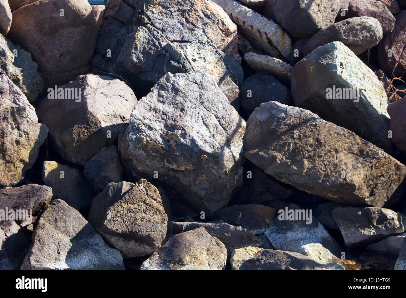 Top view of big, grey rocks (stones) at Aegean seashore in Bodrum city southwestern Turkey. Stock Photo