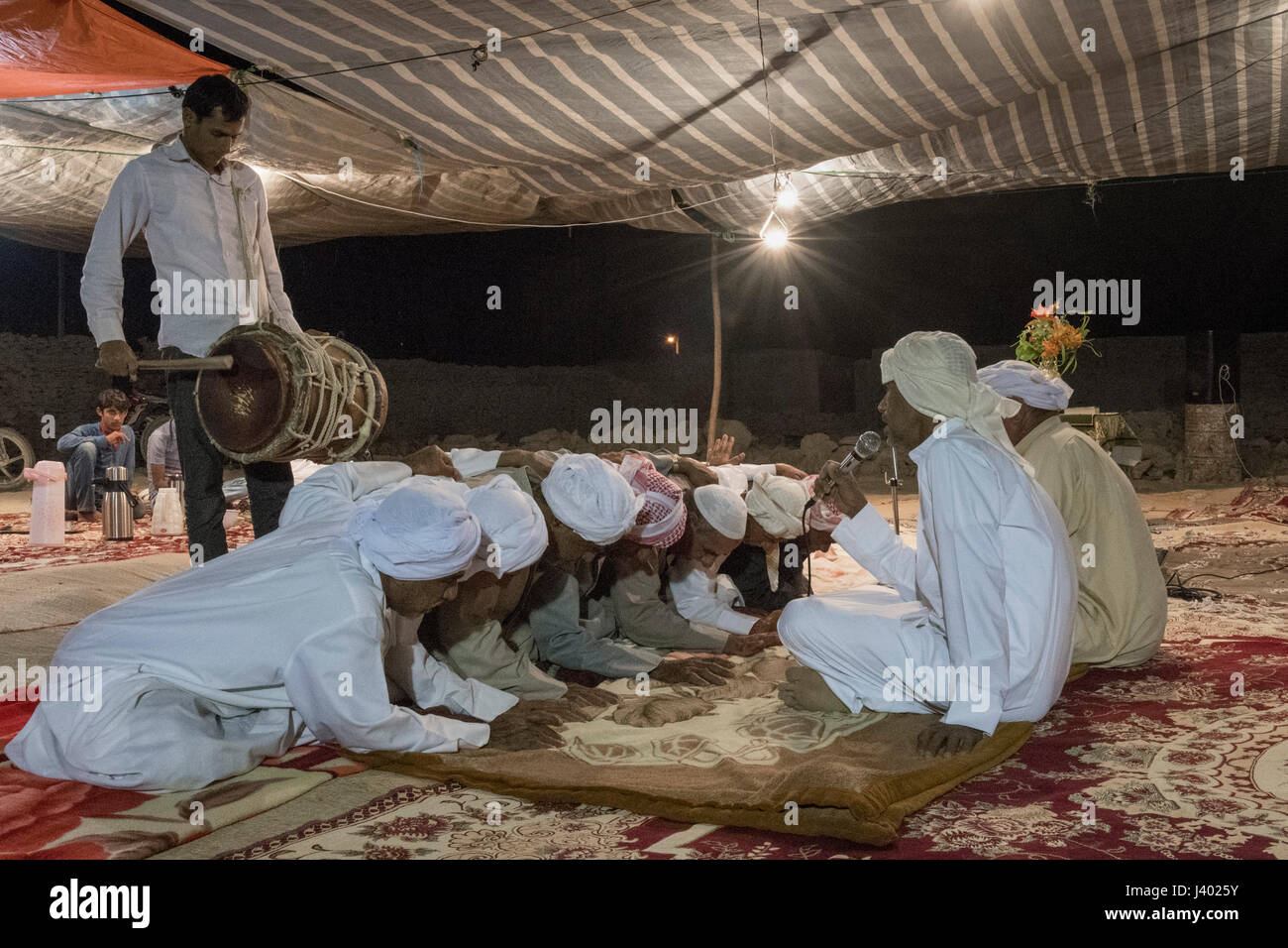 Older Men Dancing At The Sound Of A Religious Singer And A Drum Player Under A Tent On Monday Evening, The First Night Of A Traditional Wedding, Tabl, Stock Photo