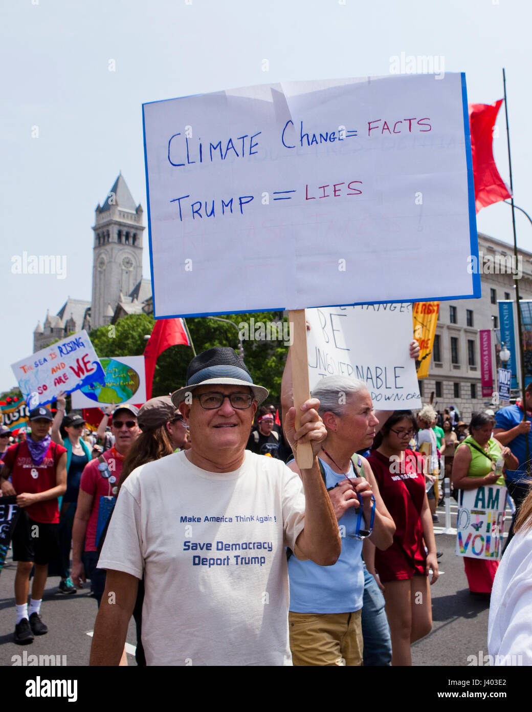 Climate change activist holding holding sign in protest - USA Stock Photo