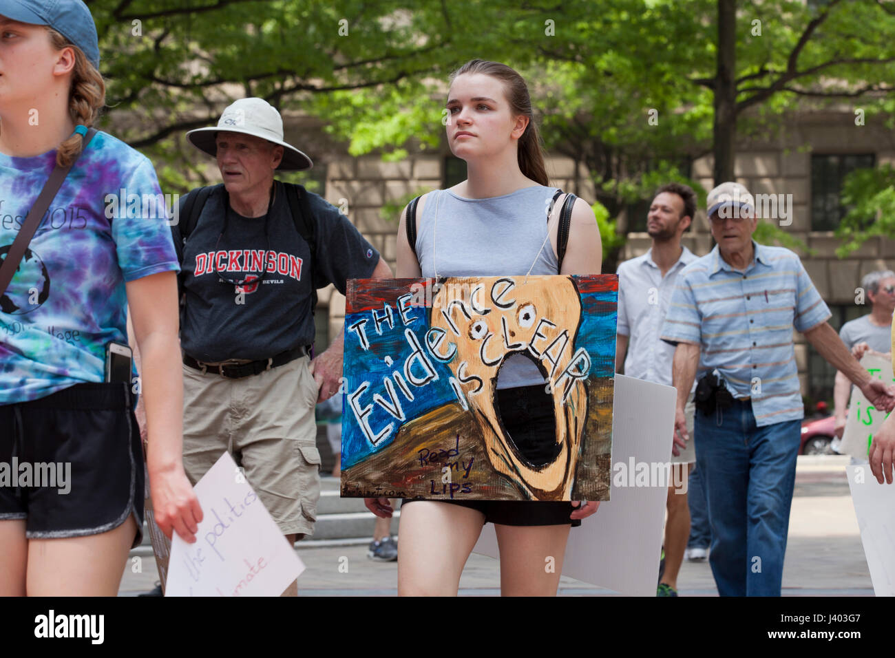 Climate change activist holding holding sign in protest - USA Stock Photo