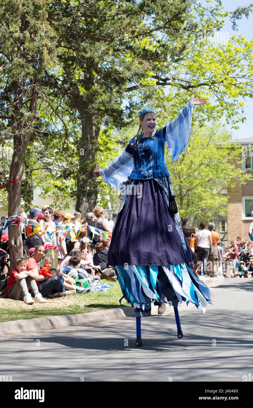 People on stilts at the Mayday parade in Minneapolis, Minnesota, USA