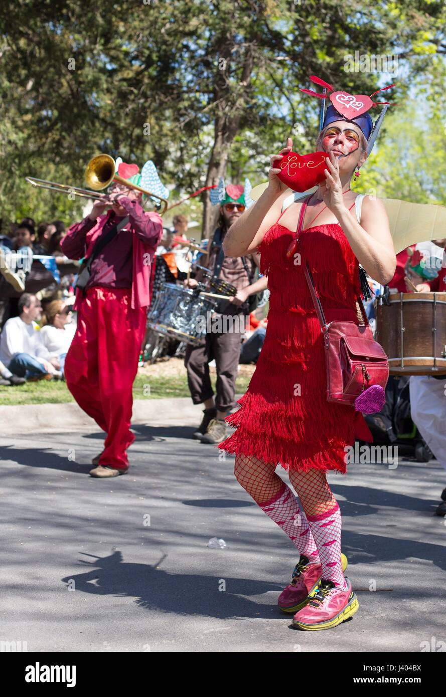 A woman dressed as "love" dancing at the Mayday parade in Minneapolis