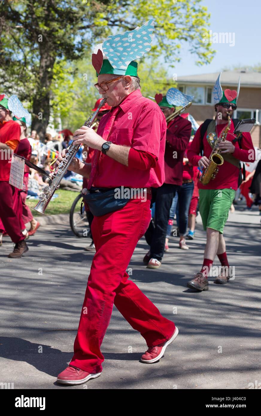 A senior man playing a in a marching band at the Mayday parade in Minneapolis