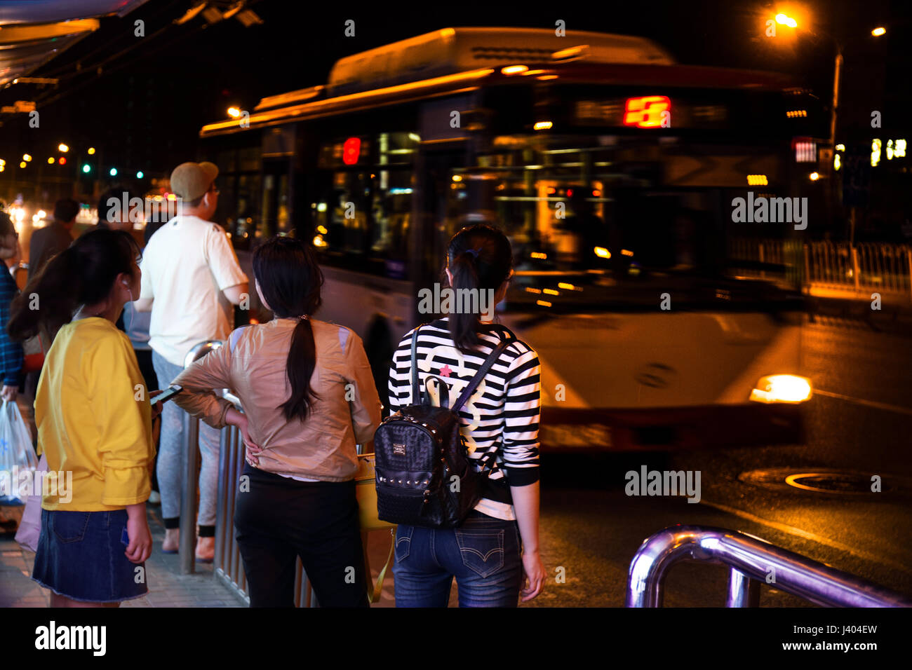 Passenger are waiting to cat h the right bus to the next destination. Motion background. Stock Photo