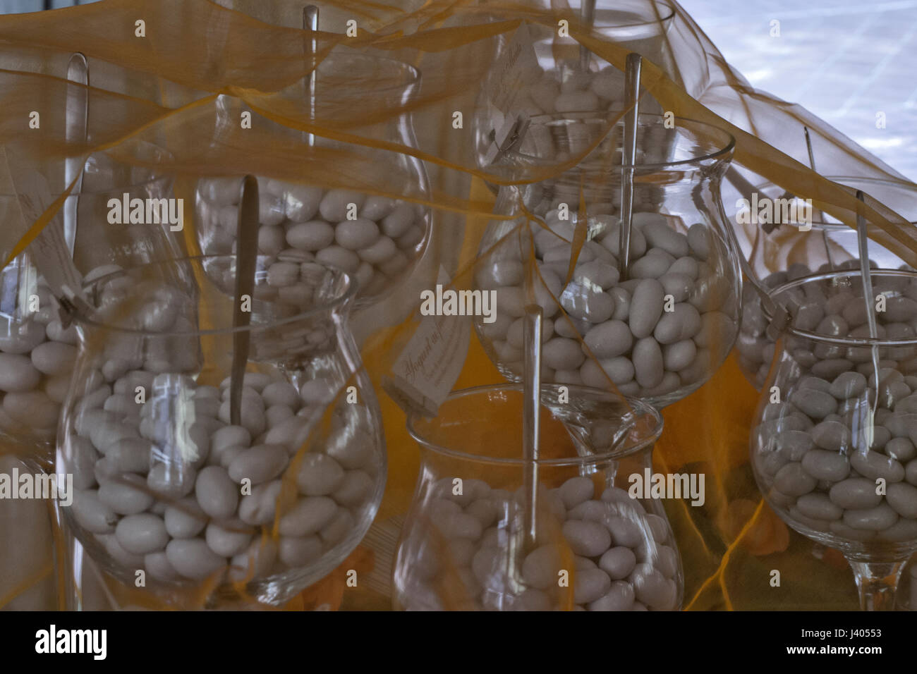 Sugared jordan almond at wedding ceremony with stem glass Stock Photo