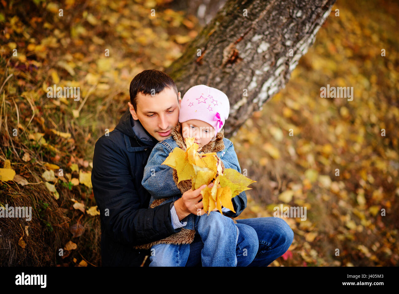 A father with daughter baby in autumn forest Stock Photo - Alamy
