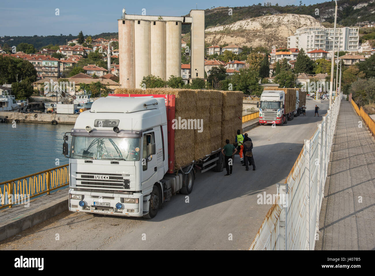 Lorries loaded with straw for The Farah Princess cargo ship in port at Balchik, a Black Sea coastal town and seaside resort in the Southern Dobruja ar Stock Photo