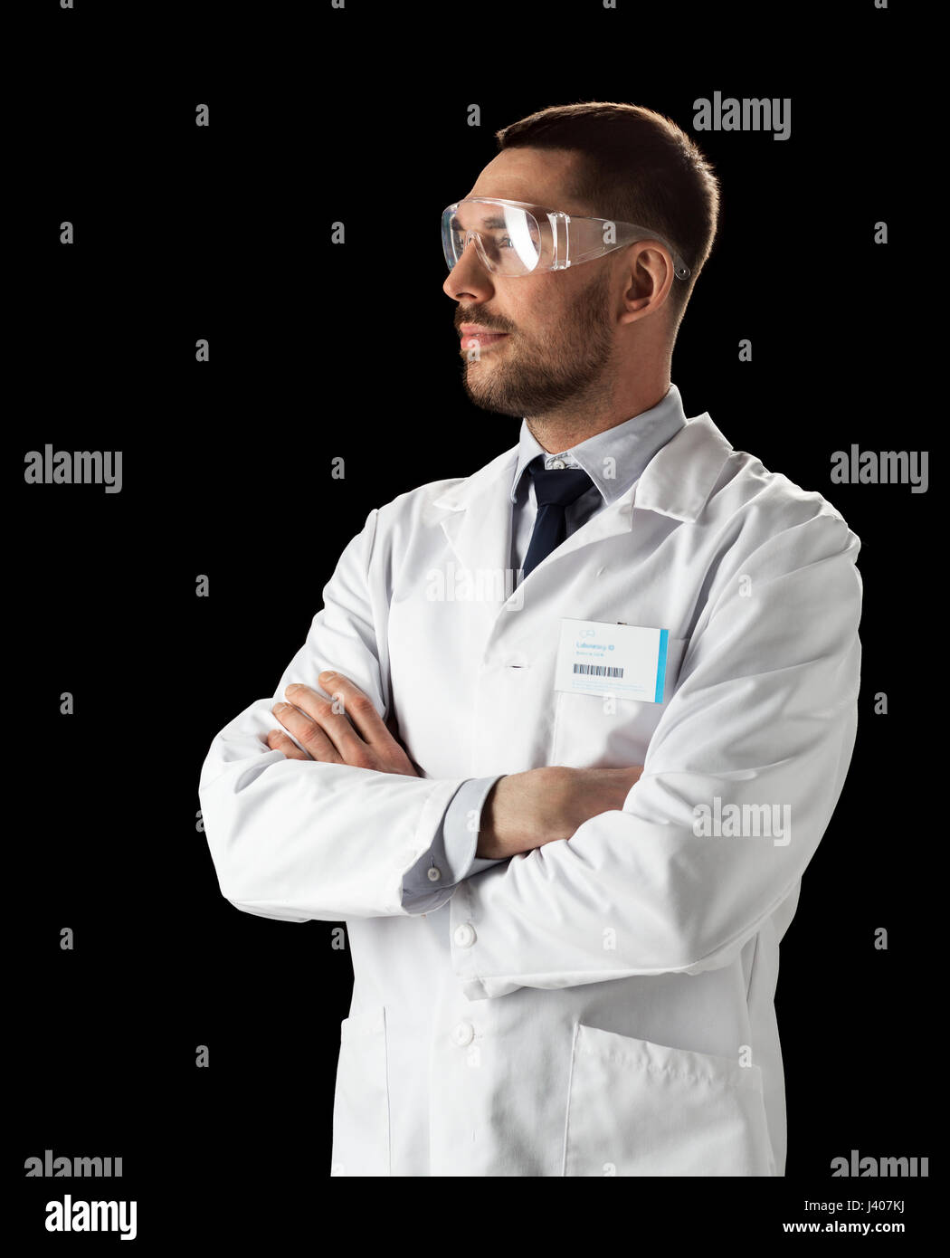 doctor or scientist in lab coat and safety glasses Stock Photo Alamy