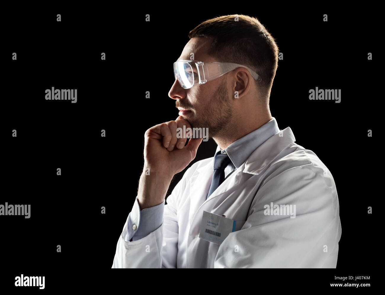 doctor or scientist in lab coat and safety glasses Stock Photo Alamy