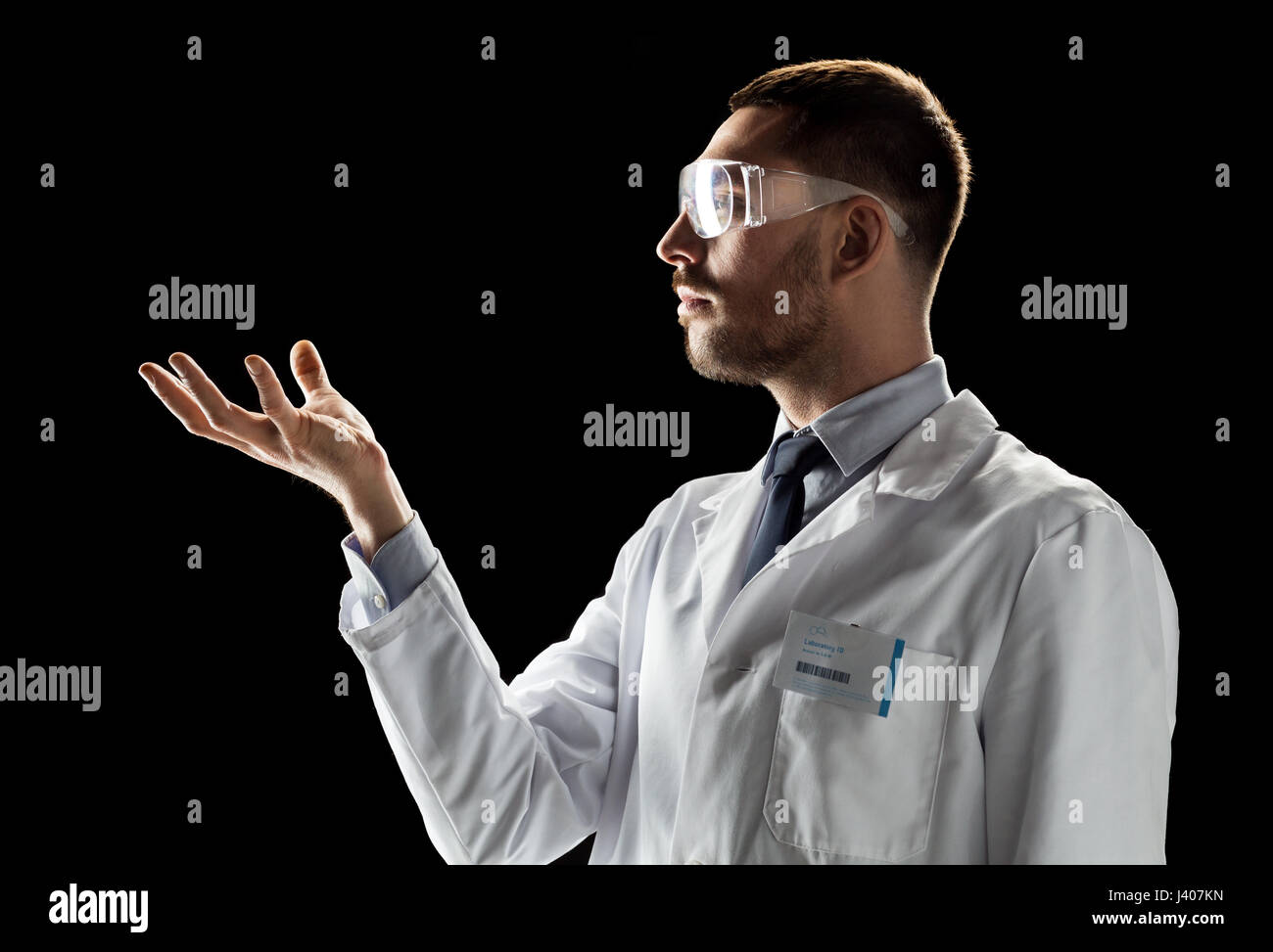 doctor or scientist in lab coat and safety glasses Stock Photo Alamy