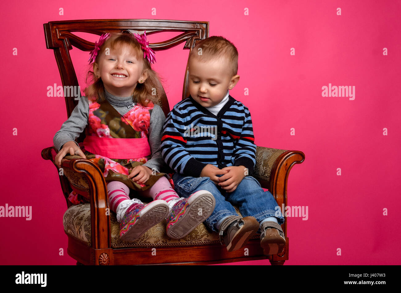 two children smiling wearing cowboy hats, Studio Stock Photo
