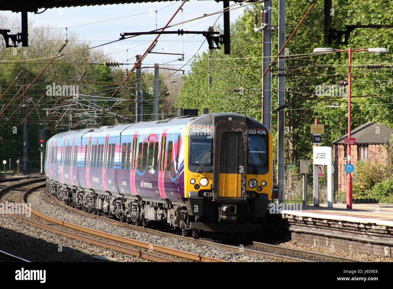 Class 350 electric multiple unit train, First Transpennine Express livery, arriving at platform 4 at Lancaster railway station on West Coast Main Line Stock Photo