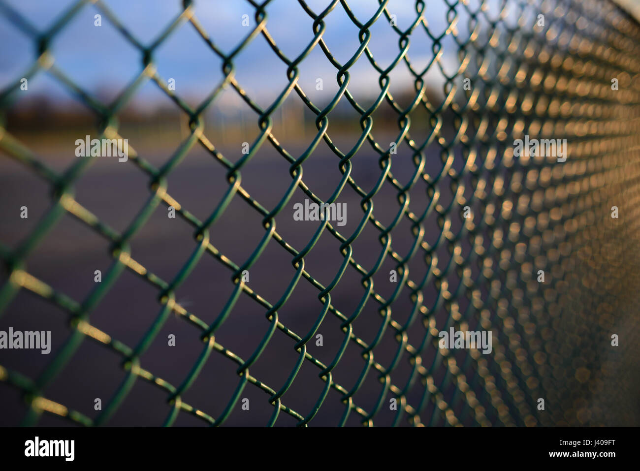 fence with metal grid in perspective, background Stock Photo - Alamy