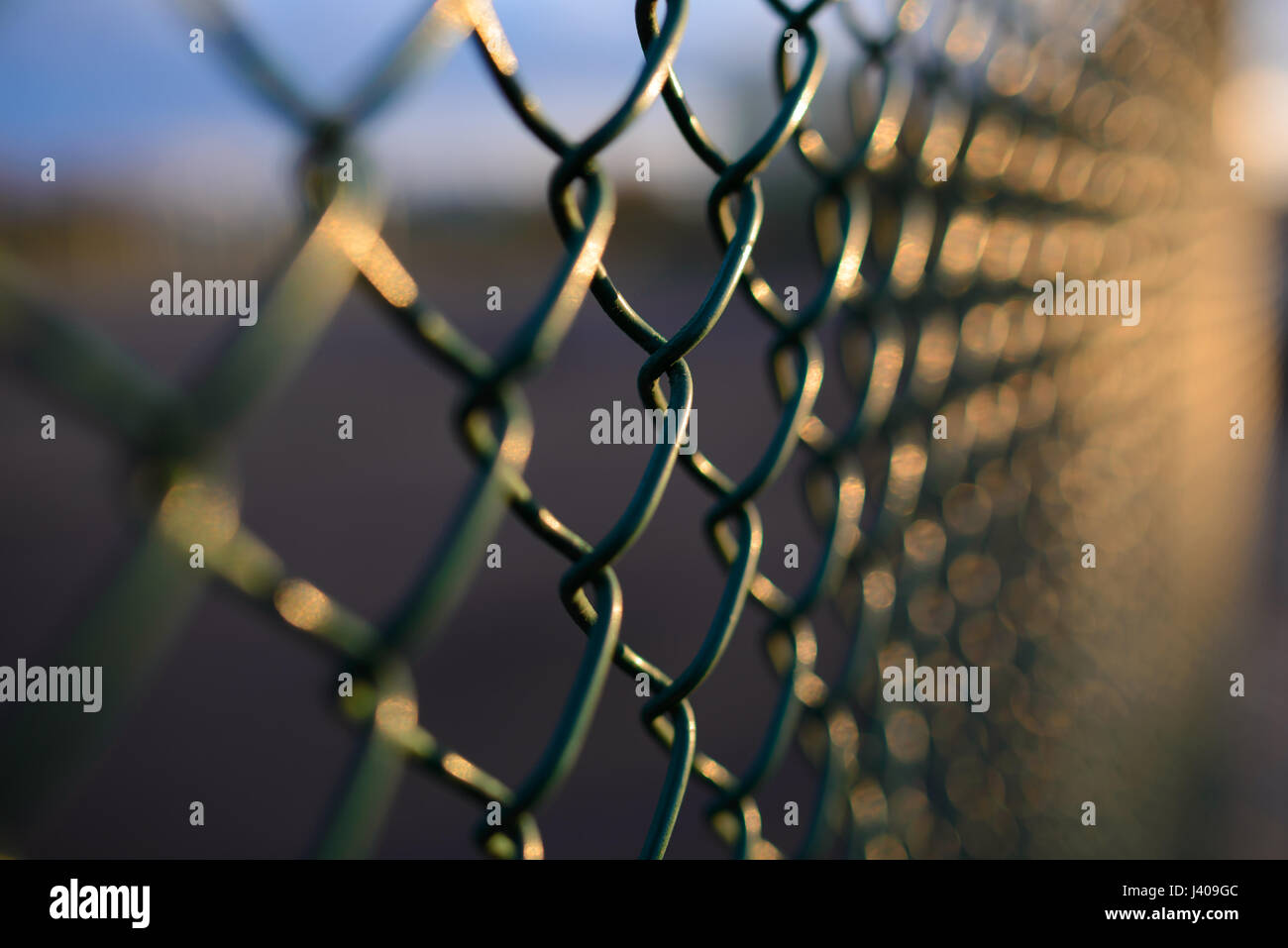 fence with metal grid in perspective, background Stock Photo - Alamy