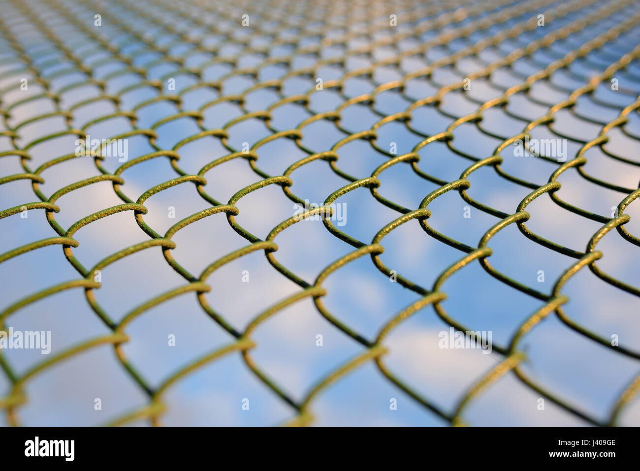 fence with metal grid in perspective, background Stock Photo - Alamy