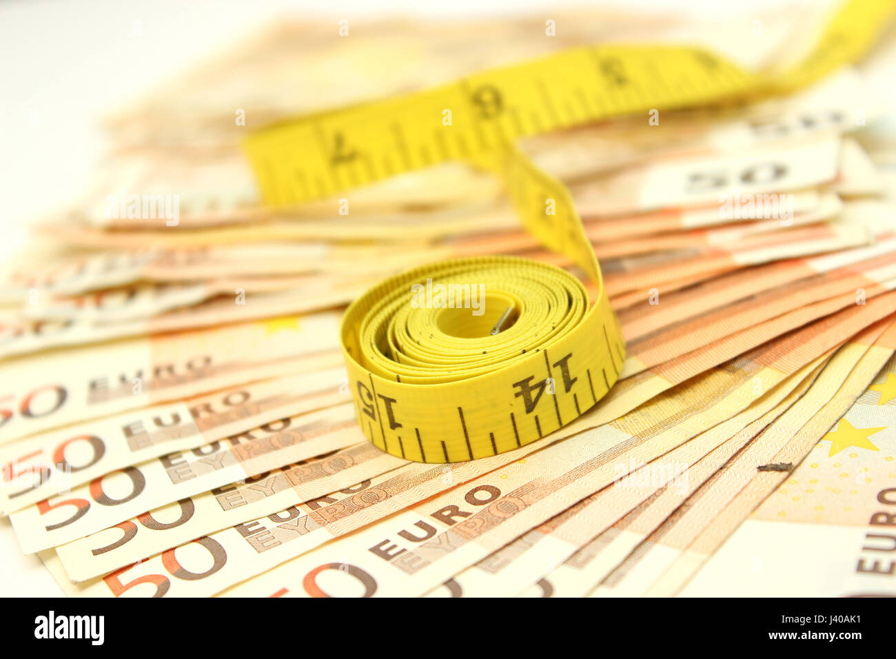 Measure tape and money Stock Photo Alamy