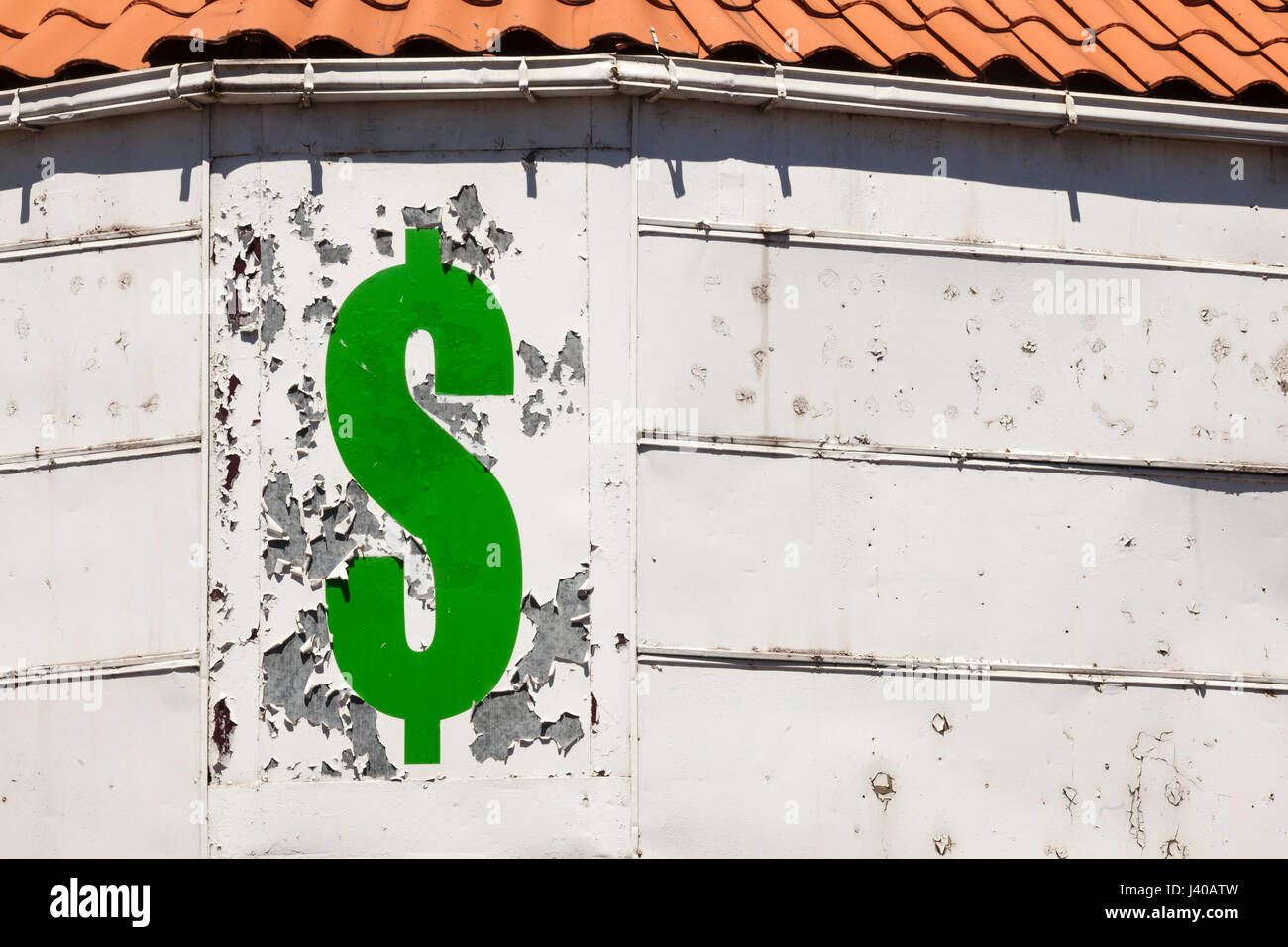 Detroit, Michigan - Peeling paint and a dollar sign on a closed store. Stock Photo