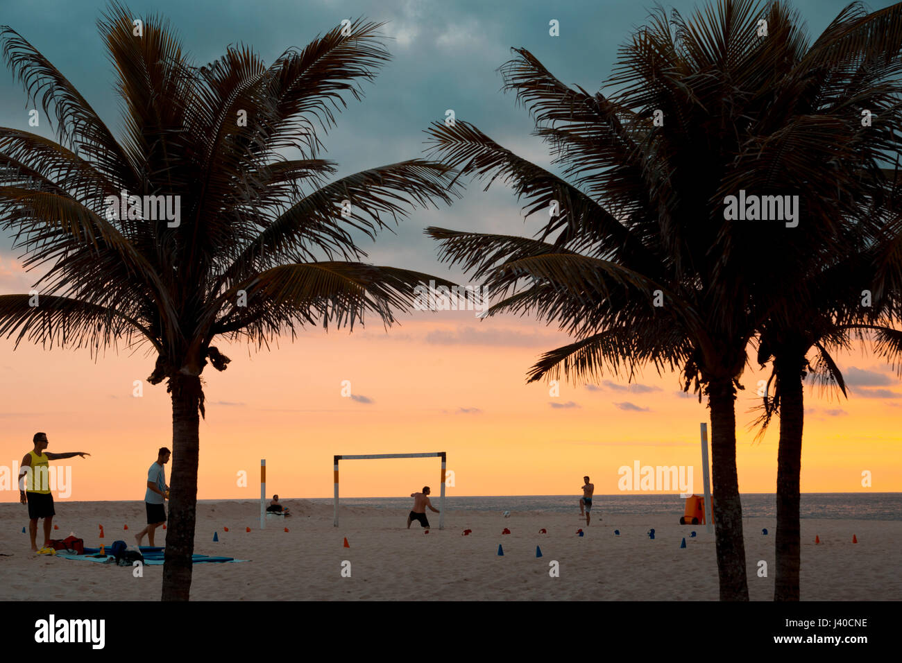 football players at Ipanema Beach during sunset, Rio de Janeiro, Brazil Stock Photo