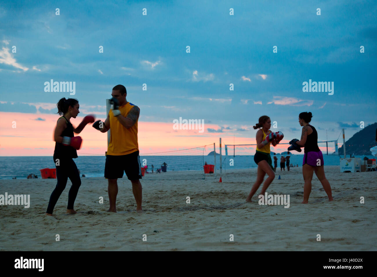 boxing with a personal trainer at Ipanema beach is a new trend sport in Rio de Janeiro Stock Photo