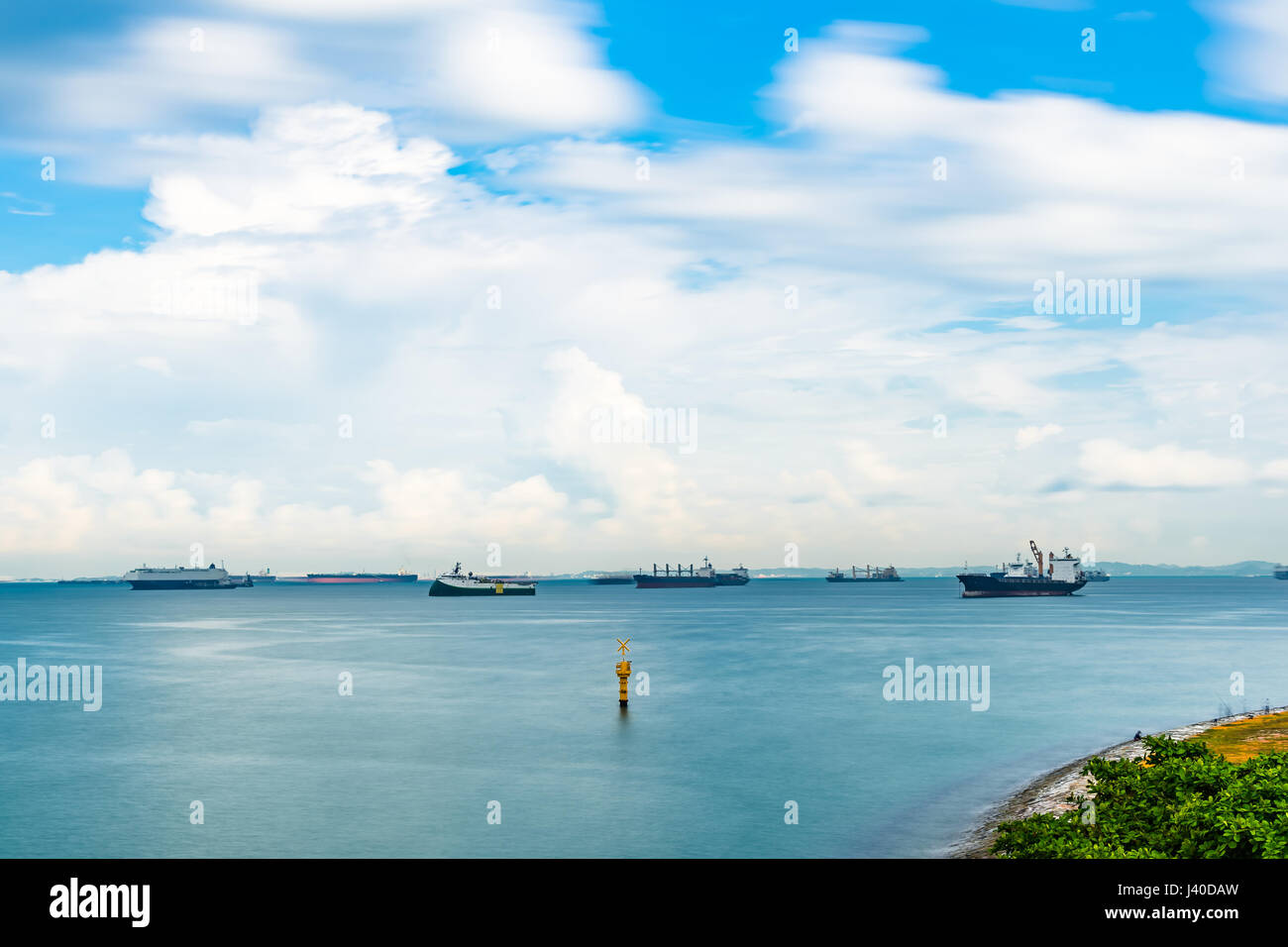 Singapore Seascape From Marina Barrage with Cargo ship at port and nice sky with cloud Stock Photo